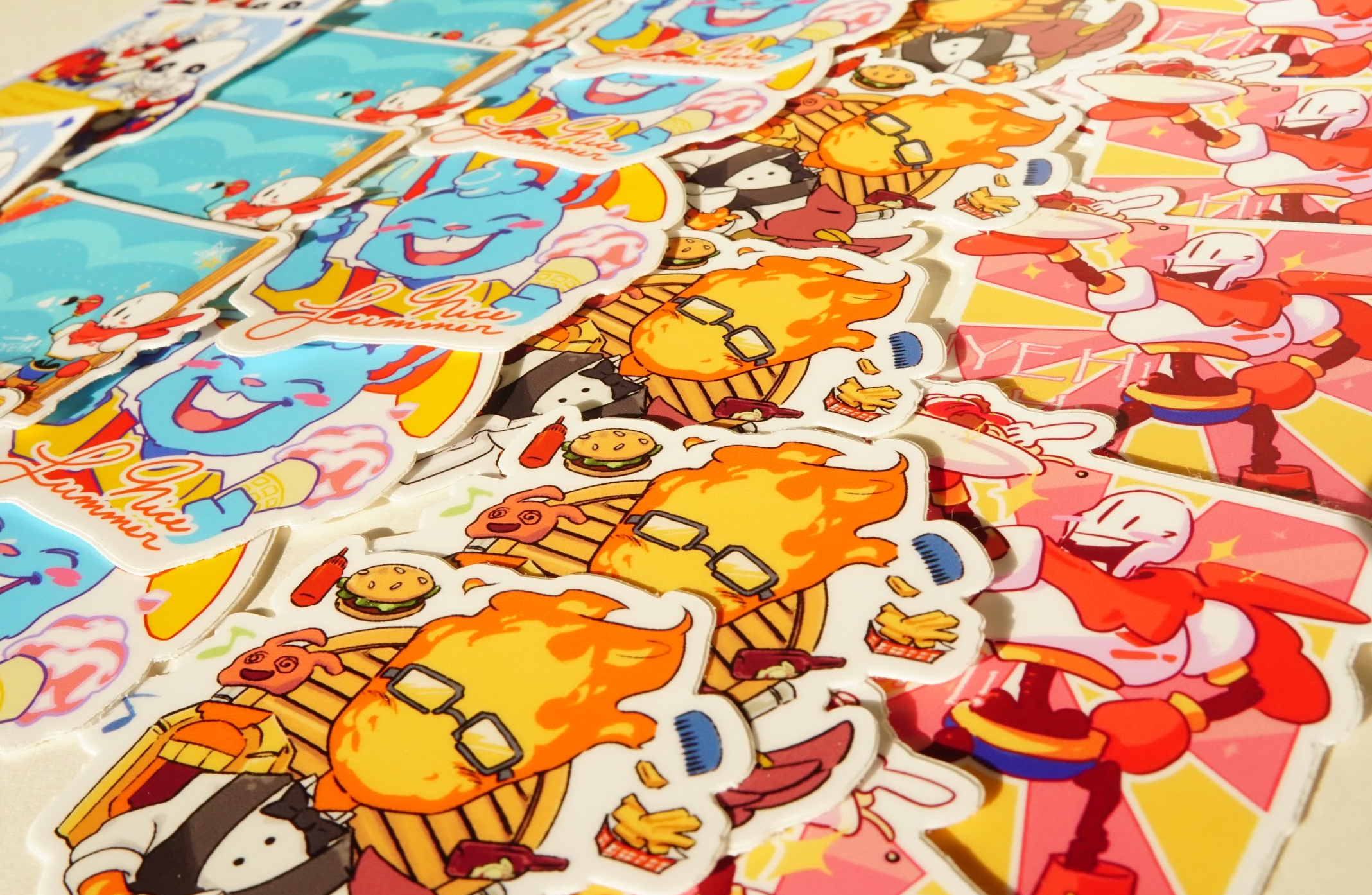 Undertale stickers stacked on top of one another.  It consists of the Ice Cream Man, Grillby, and Papyrus.
